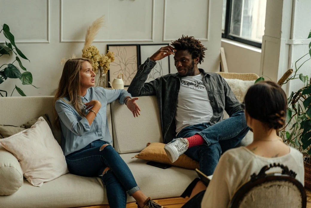 Couple discussing relationship concerns with a therapist during couples counseling