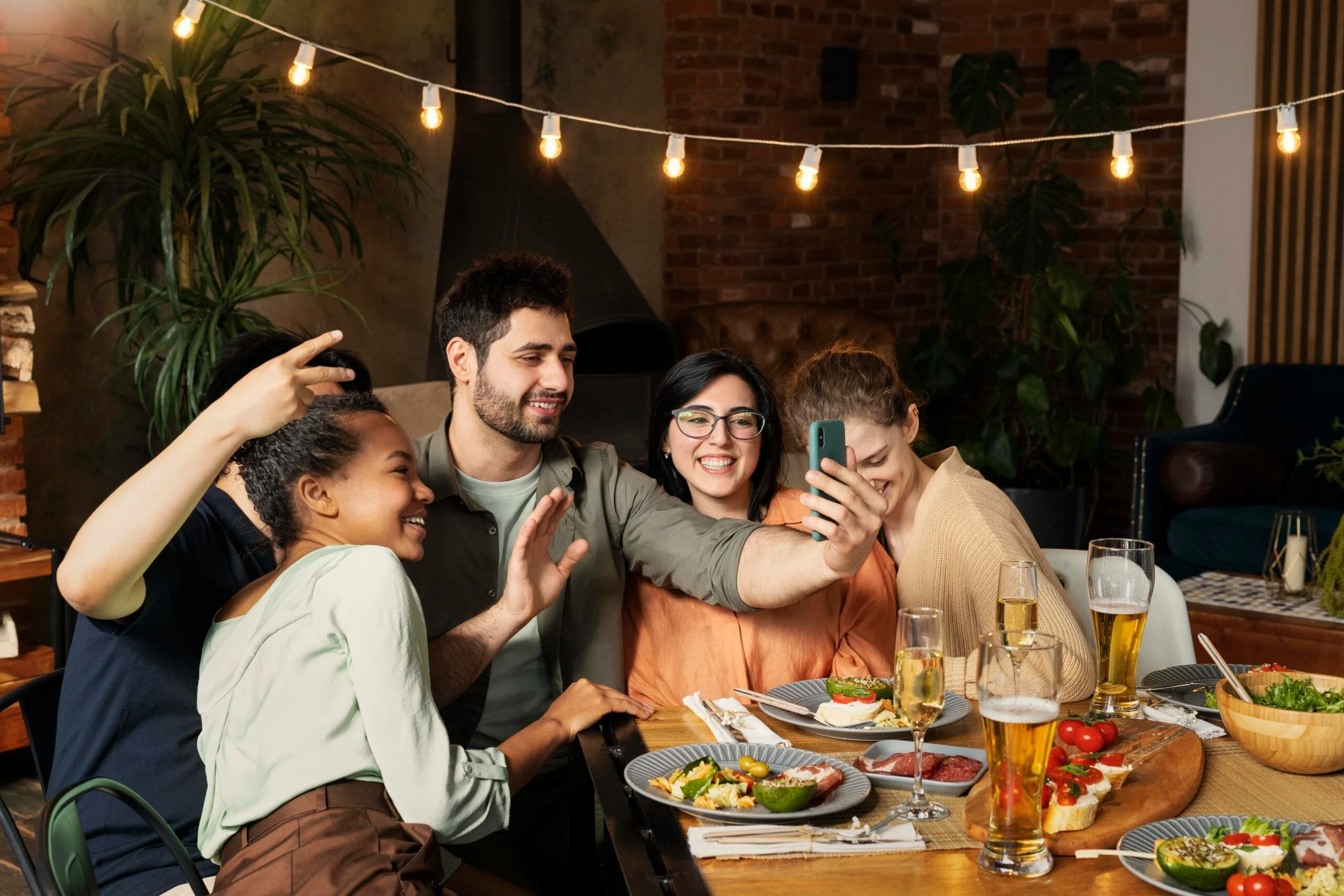 Family smiling together after building stronger connection through online family therapy
