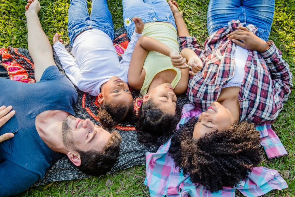 Family relaxing together during online family therapy in California