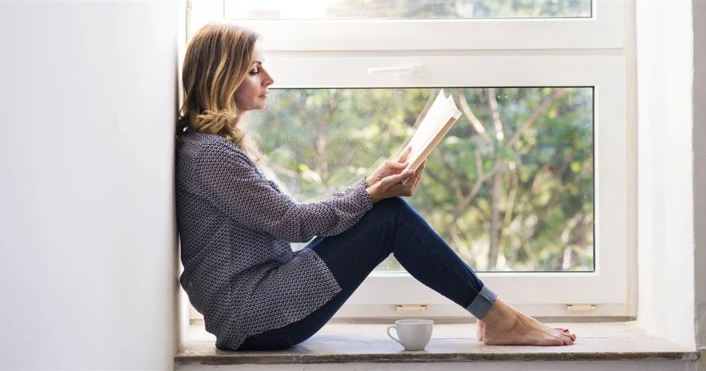 Person writing in a journal to stop overthinking and calm racing thoughts