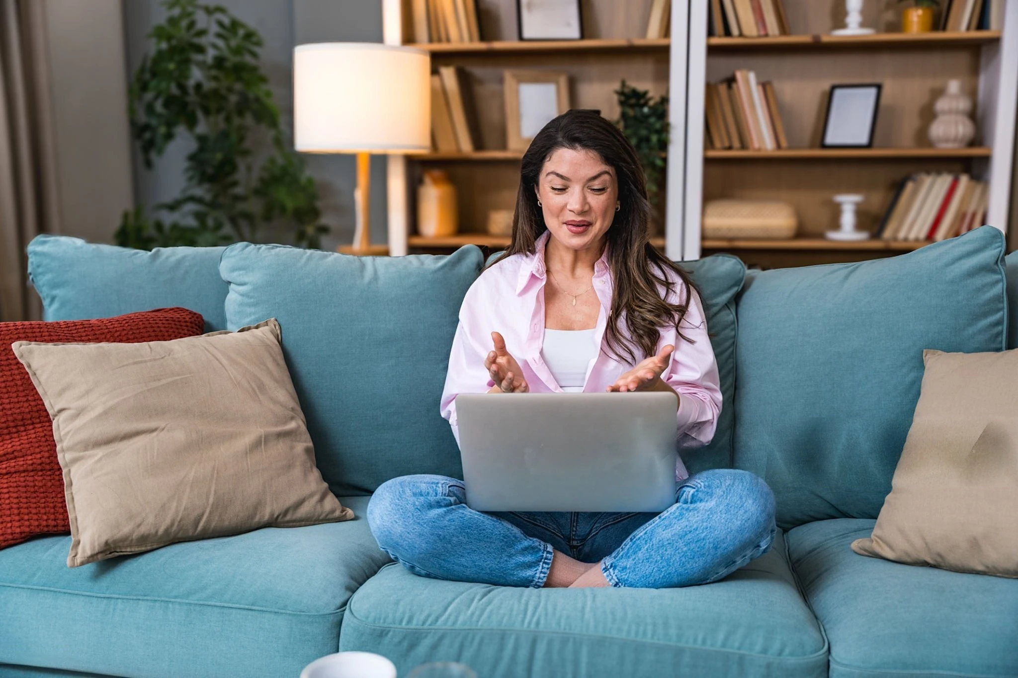 Woman attending online trauma therapy in California from home on a laptop